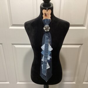 Dark denim tie with silver flower brooch